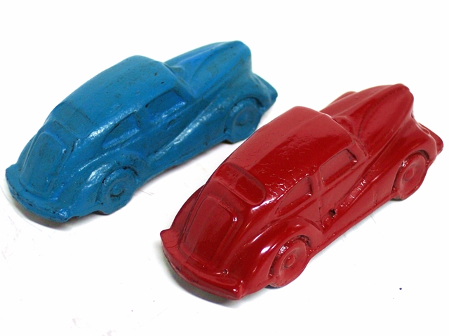 Here we have a rear quarter view of the two cars. The actual make of the car is not certain.