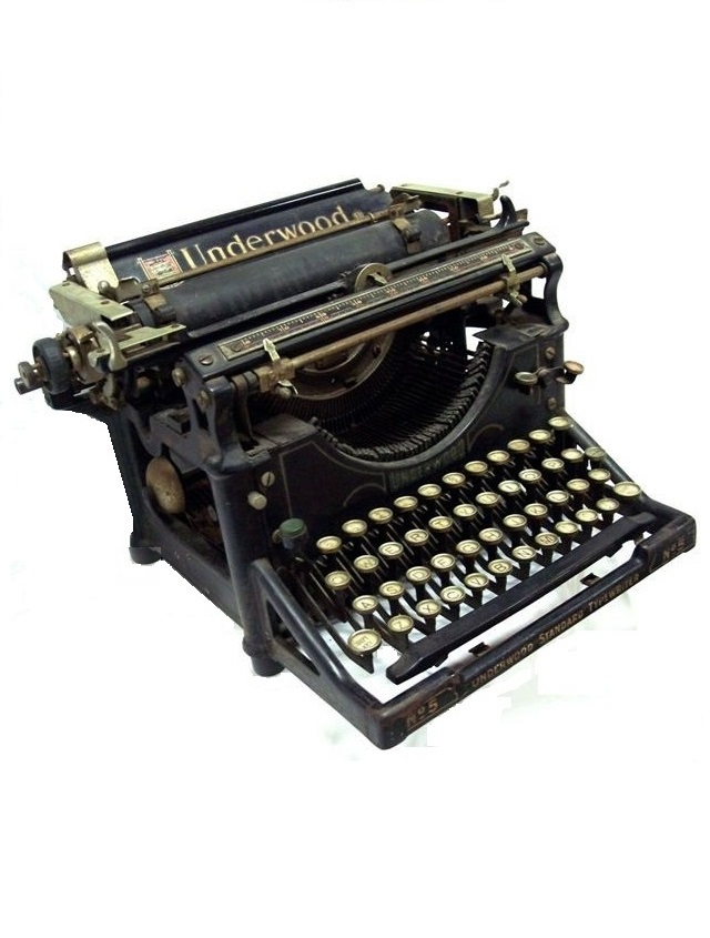 From the front along the right side of the No. 5 one can see that the basics of the No. 1 have been maintained -- why mess with success? -- but some added pin striping, logos, and labels adds a bit of dress-up to any typewriter. This one is no exception. The frame looks little different on the No. 5 from the No. 1 except that the skirt is gone and the top front corners curve in rather than out. The ribbon color selector teeter-totter is one dead giveaway for a No. 5.