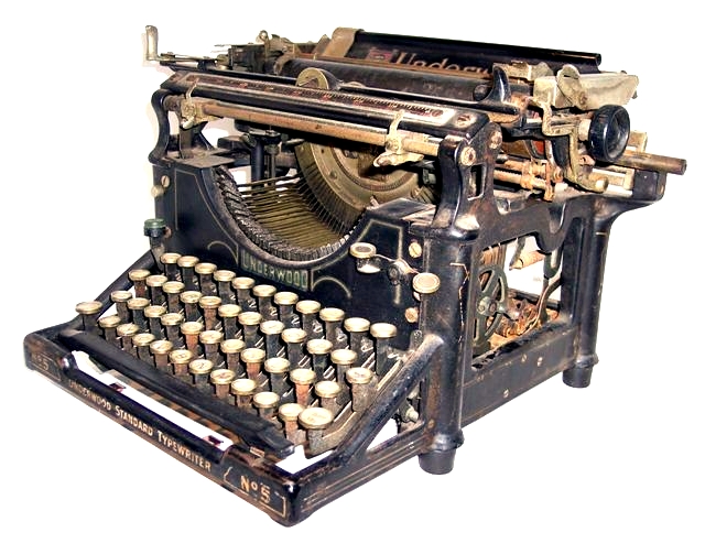 Though this view of the right side shows that little appears to have changed since the No. 1, the relatively straightforward, utilitarian lines of the predecessor of the No. 5 have been upgraded to a more curvy, flowing look. There is a finger pull that is part of the carriage casting, useful for pulling the carriage to the right. The platen and carriage adjusting and placement bits can be clearly seen. The large ribbon winding wheel with its five spokes and handle is mounted vertically and parallel with the sides of the frame. A lever locks and unlocks the spool to control the direction the ribbon travels.